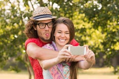Friends taking a selfie in the park royalty free stock photography Friends taking a selfie in the park royalty free stock photography