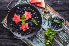 Frock Blueberry, Blackberry, Watermelon And Mint Salad On An Old Wooden Table Royalty Free Stock Image