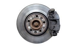 Front brake discs with caliper and brake pads in the car, isolated on a white background with a clipping path. stock photo Front brake discs with caliper and brake pads in the car, isolated on a white background with a clipping path. stock photo