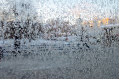 Frost Patterns On A Glass. Blurred City View Through A Frosted Window. Concept Of Extremely Cold Weather Conditions Stock Photos Frost Patterns On A Glass. Blurred City View Through A Frosted Window. Concept Of Extremely Cold Weather Conditions Stock Photos