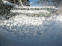 Frosty winter patterns on the glass. Horizontal background royalty free stock photography Frosty winter patterns on the glass. Horizontal background royalty free stock photography