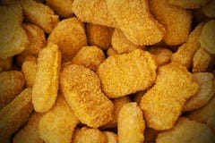Frozen nuggets spread out evenly as a background. royalty free stock photo Frozen nuggets spread out evenly as a background. royalty free stock photo