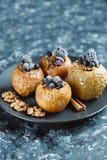 Fruit dessert baked apples stuffed with blackberry, blueberries, cinnamon, nuts, honey. royalty free stock photography Fruit dessert baked apples stuffed with blackberry, blueberries, cinnamon, nuts, honey. royalty free stock photography