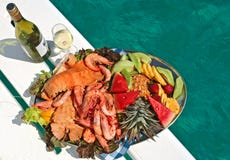 Fruit and seafood platter with wine