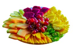 Fruit tray red pitaya dragon fruit, pineapple, grapes, mango, melon, kiwi on plate isolated on white background. royalty free stock image Fruit tray red pitaya dragon fruit, pineapple, grapes, mango, melon, kiwi on plate isolated on white background. royalty free stock image