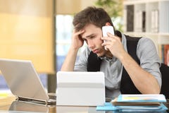 Frustrated businessman with multiple devices Royalty Free Stock Photo Frustrated businessman with multiple devices Royalty Free Stock Photo
