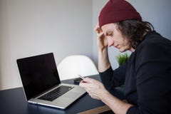 Frustrated site user calls support. Development and work on the Internet, a phone call. royalty free stock image Frustrated site user calls support. Development and work on the Internet, a phone call. royalty free stock image