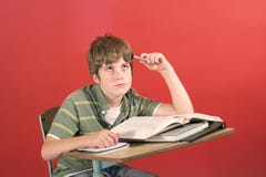 Frustrated Student At His Desk Royalty Free Stock Photography