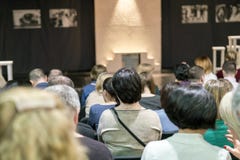 The full audience hall in the theater is waiting for the beginning of the performance. stock photos The full audience hall in the theater is waiting for the beginning of the performance. stock photos