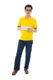 Full body Asian adult student in casual wear with school bag using digital computer tablet pc standing isolated on white stock photography Full body Asian adult student in casual wear with school bag using digital computer tablet pc standing isolated on white stock photography