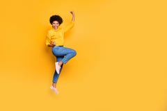 Full Length Body Size Photo Of Jumping Curly Wavy Strong And Powerful Black Woman Rejoicing With Her Victorious Glory Royalty Free Stock Photography