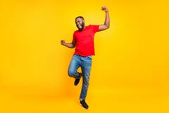 Full Length Body Size Photo Of Rejoicing Glad Cheerful Happy Black Man Dancing With Joy While Isolated With Yellow Stock Photo