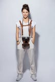 Full length portrait of a smiling casual woman standing on white background and looking at camera. royalty free stock photos Full length portrait of a smiling casual woman standing on white background and looking at camera. royalty free stock photos