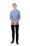 Full length portrait of thoughtful teenager guy looking down as feel guilty and ashamed isolated over white. Boy experiencing