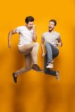 Full length portrait of a two excited young men royalty free stock images Full length portrait of a two excited young men royalty free stock images