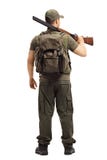 Hunter standing with a shotgun from behind stock images Hunter standing with a shotgun from behind stock images