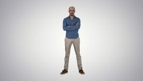 Serious confident arabian man in casual folds hands looking into camera on gradient background. stock video Serious confident arabian man in casual folds hands looking into camera on gradient background. stock video