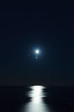 Full moon over dark water with reflections on it Stock Photos Full moon over dark water with reflections on it Stock Photos