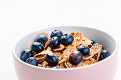 Full Muesli Bowl On A White Table With Blueberry. Healthy Breakfast Cereals With Milk, Seed, Fruit. Oat Flakes Stock Photography Full Muesli Bowl On A White Table With Blueberry. Healthy Breakfast Cereals With Milk, Seed, Fruit. Oat Flakes Stock Photography