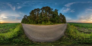 Full seamless spherical hdri panorama 360 degrees angle view on gravel road among fields in summer evening sunset with awesome royalty free stock photo Full seamless spherical hdri panorama 360 degrees angle view on gravel road among fields in summer evening sunset with awesome royalty free stock photo
