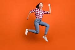 Full Size Length Body Photo Of Cheerful Rejoicing Delightful Ecstatic Girl Enjoying Leisure Free Time Jumping Up Royalty Free Stock Photo