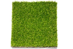 Fundo artificial verde ascendente fechado da placa da grama fotografia de stock royalty free Fundo artificial verde ascendente fechado da placa da grama fotografia de stock royalty free