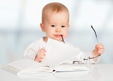 Funny baby reading a book stock photos Funny baby reading a book stock photos
