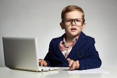 Funny business child with computer stock photos Funny business child with computer stock photos