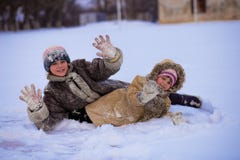 Funny children playing and laughing on snowy winter stock images Funny children playing and laughing on snowy winter stock images