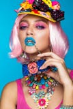 Funny comic girl with bright make-up in the style of pop art. Creative image. Beauty face. royalty free stock photography Funny comic girl with bright make-up in the style of pop art. Creative image. Beauty face. royalty free stock photography