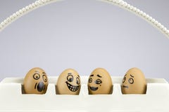 Funny eggs with painted faces stock illustration Funny eggs with painted faces stock illustration