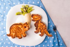 Funny food for kids: Pancake in the form of dinosaurs
