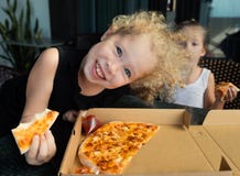 Funny kids eating pizza
