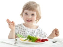 Funny little girl eating stock photography Funny little girl eating stock photography