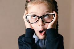 Surprised little girl with glasses stock photos Surprised little girl with glasses stock photos