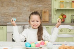 Funny little girl with two Easter eggs stock image Funny little girl with two Easter eggs stock image
