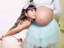 Funny Little Girl With Her Pregnant Mother Royalty Free Stock Photos Funny Little Girl With Her Pregnant Mother Royalty Free Stock Photos