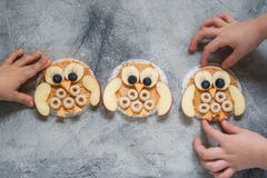 Funny Owl With Peanut Butter And Fruits On Rice Cake Stock Images