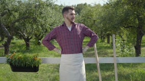 Funny young bearded farmer fooling around, imitating playing guitar using the pitchfork, then noticing camera and stock video Funny young bearded farmer fooling around, imitating playing guitar using the pitchfork, then noticing camera and stock video
