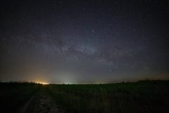 Galaxy The Milky Way in the night sky with stars. Rural road at Royalty Free Stock Photo Galaxy The Milky Way in the night sky with stars. Rural road at Royalty Free Stock Photo