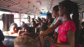 GALLE, SRI LANKA - MARCH 2014: Interior view of a crowded in a bus from Galle to Hikkaduwa. Buses are the main means of public