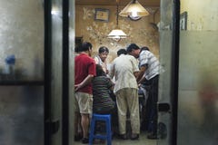 Gamblers in room off hutongs in beijing, China