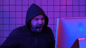 Gamer Giving Commands into Microphone. He Plays in Multiplayer Video Game. royalty free stock images Gamer Giving Commands into Microphone. He Plays in Multiplayer Video Game. royalty free stock images