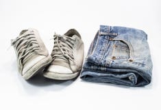Gammal jeans och gamla skor arkivbild Gammal jeans och gamla skor arkivbild