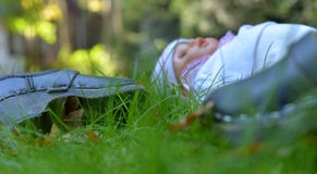 Clogs and doll left in the garden. royalty free stock photo Clogs and doll left in the garden. royalty free stock photo