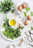 Garden herbs, spices and eggs on a light table. Rustic kitchen still life. Ingredients for cooking. Top view Stock Photo Garden herbs, spices and eggs on a light table. Rustic kitchen still life. Ingredients for cooking. Top view Stock Photo