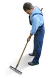 Gardener - worker in working clothes, raking the garden