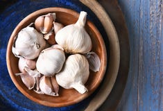 Image result for garlic on the blue table
