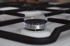 Gas stove, blue fire. The use of domestic gas for domestic purposes stock images Gas stove, blue fire. The use of domestic gas for domestic purposes stock images