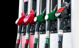 Gasoline and diesel distributor at the gas station. Gas pump nozzles. Petrol filling gun close-up at the gas station. Colorful Pet stock photography Gasoline and diesel distributor at the gas station. Gas pump nozzles. Petrol filling gun close-up at the gas station. Colorful Pet stock photography